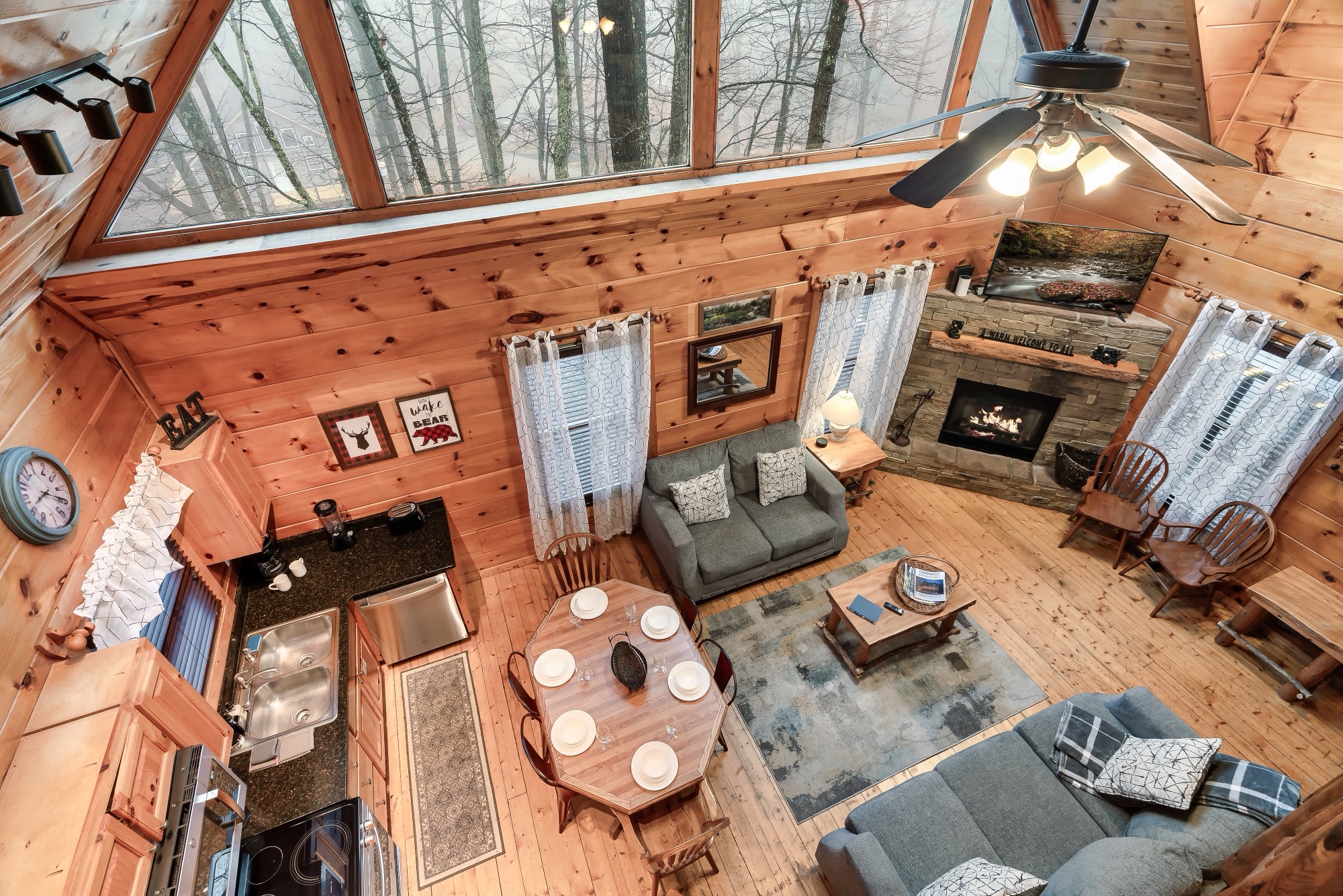 Elevated view down into Bearadise's open concept kitchen, dining, and living area